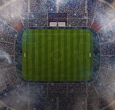 Aerial view of a packed soccer stadium.