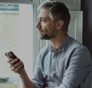 man looking at phone